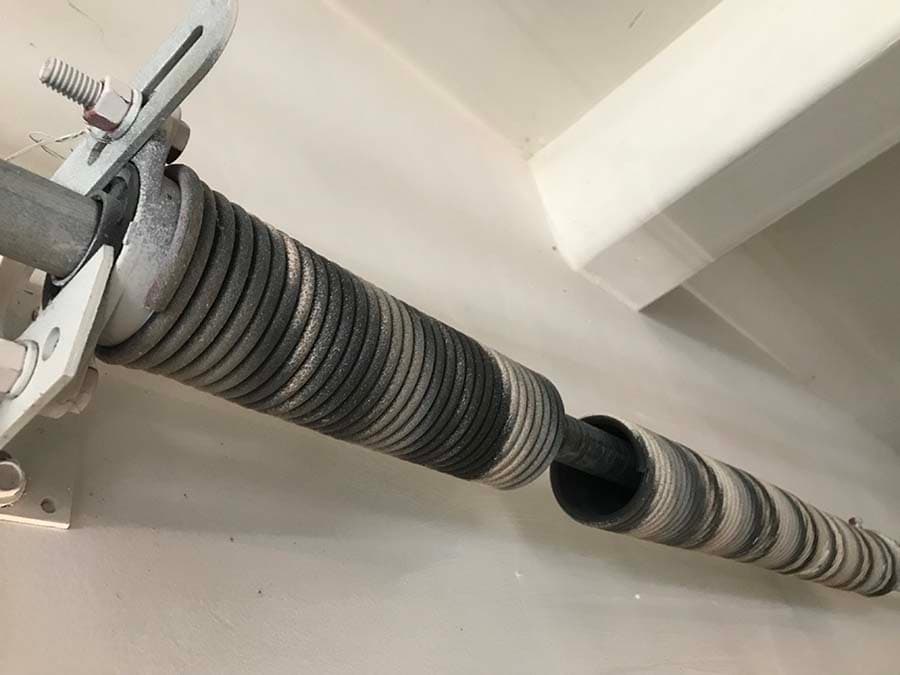Torsion Spring Safety: What Every Homeowner Needs to Know Before Touching Their Door